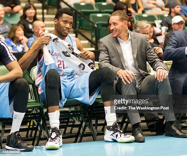Texas Legends basketball player Delonte West chats with teammate Eric Griffin on the bench at the Dr. Pepper Arena on April 1, 2015 in Frisco, Texas....