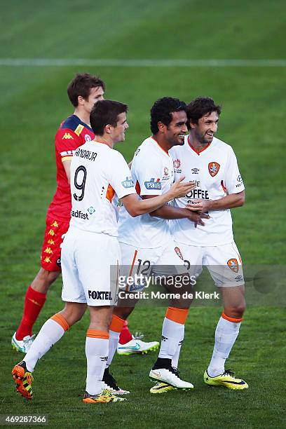 Roar players celebrate an own-goal by Adelaide during the round 25 A-League match between Adelaide United and the Brisbane Roar at Coopers Stadium on...