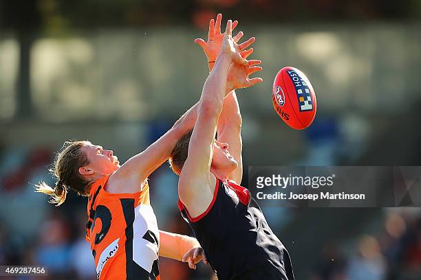 Colin Garland of the Demons competes with Cam McCarthy of the Giants during the round two AFL match between the Greater Western Sydney Giants and the...