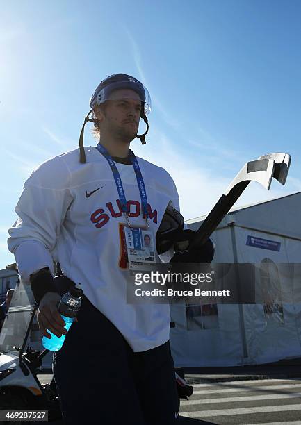 Juhamatti Aaltonen of Finland walks to the arena on day seven of the Sochi 2014 Winter Olympics at Bolshoy Ice Dome on February 14, 2014 in Sochi,...