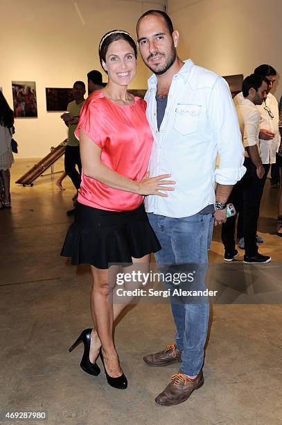 Veronica Vomit and Ilan Corres attend Andrew Levitas Metalwork Playground opening reception at Blueshift Wynwood on April 10, 2015 in Miami, Florida.