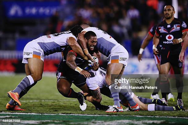 Manu Vatuvei of the Warriors is brought down during the round six NRL match between the New Zealand Warriors and the Wests Tigers at Mt Smart Stadium...