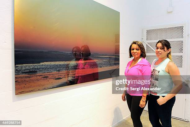 Gladis Gomes and Keylie Vargas attend Andrew Levitas Metalwork Playground opening reception at Blueshift Wynwood on April 10, 2015 in Miami, Florida.