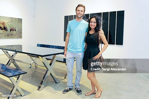 Andrew Vaaler and Gisela Grey attend Andrew Levitas Metalwork Playground opening reception at Blueshift Wynwood on April 10, 2015 in Miami, Florida.