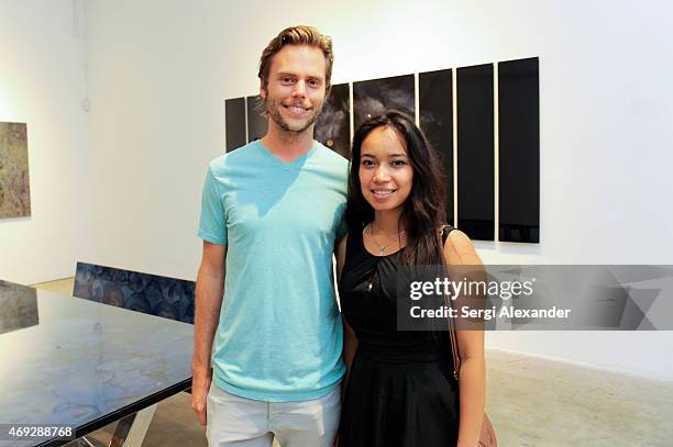 Andrew Vaaler and Gisela Grey attend Andrew Levitas Metalwork Playground opening reception at Blueshift Wynwood on April 10, 2015 in Miami, Florida.