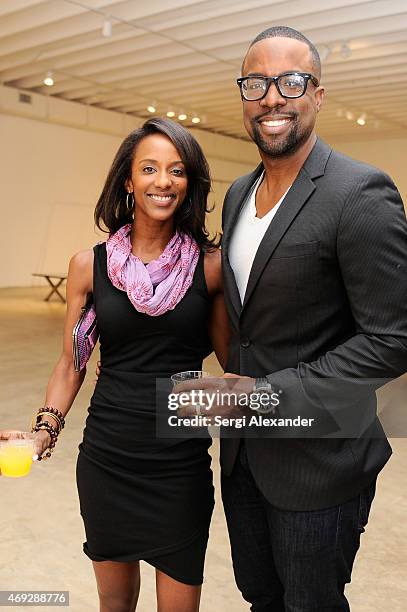 Deanndria Mujahid and Faheem Mujahid attend Andrew Levitas Metalwork Playground opening reception at Blueshift Wynwood on April 10, 2015 in Miami,...
