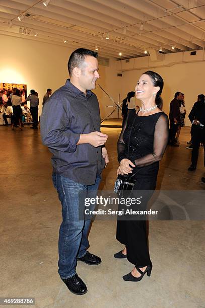 Othon Catsaneda and Cristiane Roget attend Andrew Levitas Metalwork Playground opening reception at Blueshift Wynwood on April 10, 2015 in Miami,...