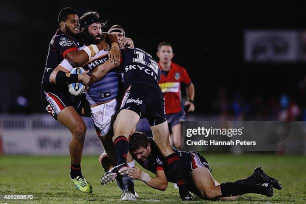 Aaron Woods of the Tigers is brought down during the round six NRL match between the New Zealand Warriors and the Wests Tigers at Mt Smart Stadium on...