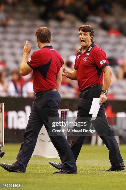 Demons coach Paul Roos yells at Josh Mahoney during the round one AFL NAB Challenge Cup match between the Richmond Tigers and the Melbourne Demons at...