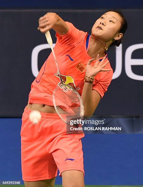 China's Sun Yu plays against compatriot Wang Shixian in their women's single semi-finals of the Singapore Open on April 11, 2015. AFP PHOTO / ROSLAN...