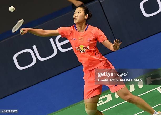 China's Sun Yu plays against compatriot Wang Shixian in their women's single semi-finals of the Singapore Open on April 11, 2015. AFP PHOTO / ROSLAN...