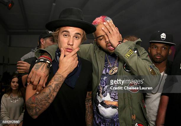 Singers Justin Bieber and Chris Brown attends the NYLON Midnight Garden Party at a private residence on April 10, 2015 in Bermuda Dunes, California.