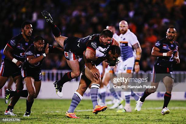 Jacob Lillyman of the Warriors tackles Martin Taupau of the Tigers during the round six NRL match between the New Zealand Warriors and the Wests...