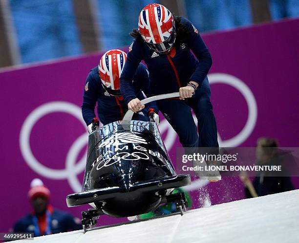 Great Britain-1, two-woman bobsleigh steered by Paula Walker, takes a practice run during a training session at the Sanki Sliding Center in Rosa...