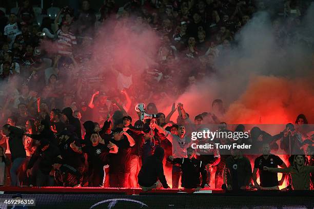 Western Sydney Wanderers fans let off flares during the round 25 A-League match between the Central Coast Mariners and the Western Sydney Wanderers...