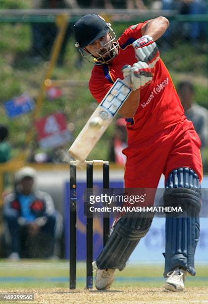 Cricket players from Nepal and Australia take part in a match held as a tribute to late Australian cricket player Phillip Hughes in Kathmandu on...