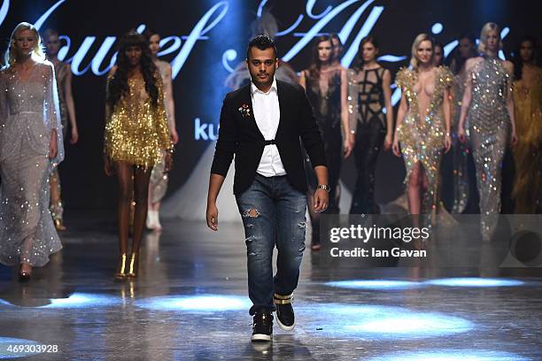 The designer walks the runway at the Yousef Al-Jasmi show during Dubai Fashion Forward April 2015 at Madinat Jumeirah on April 11, 2015 in Dubai,...