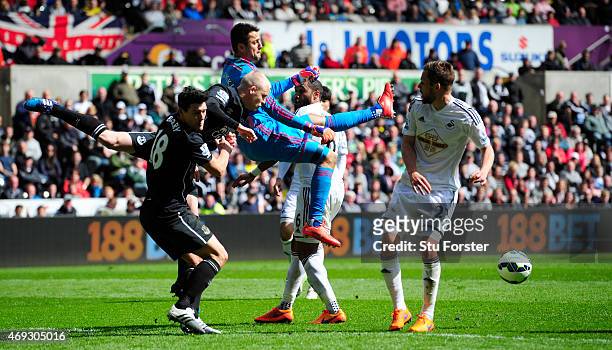 Swansea goalkeeper Lukasz Fabianski is challenged by Steven Naismith and Gareth Barry of Everton during the Barclays Premier League match between...