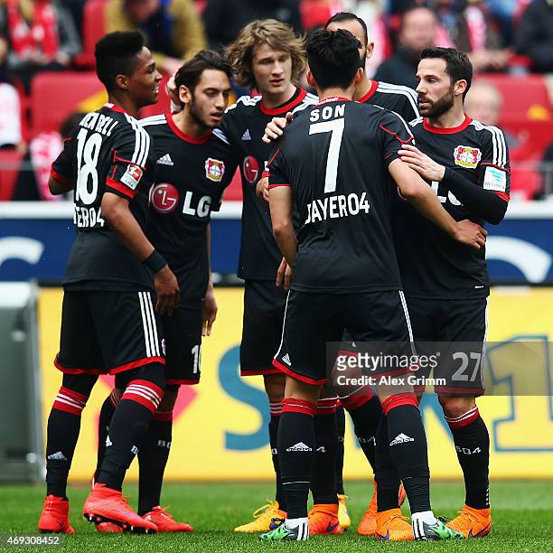 Heung-Min Son of Leverkusen celebrates his team's first goal with team mates during the Bundesliga match between 1. FSV Mainz 05 and Bayer 04...