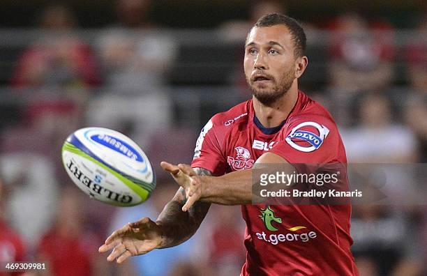 Quade Cooper of the Reds passes the ball during the Super Rugby trial match between the Queensland Reds and the Melbourne Rebels at Ballymore Stadium...