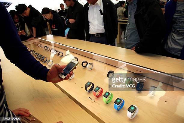 Customer takes photos of Apple Watch smartwatches at an Apple Store at Lujiazui in Pudong District on April 11, 2015 in Shanghai, China. Apple's...