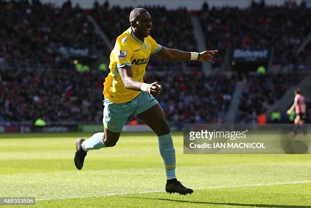 Crystal Palace's French-born Congolese midfielder Yannick Bolasie celebrates scoring their second goal during the English Premier League football...