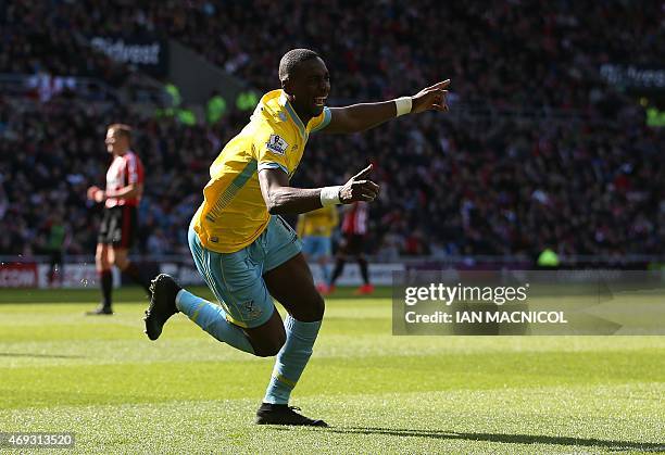 Crystal Palace's French-born Congolese midfielder Yannick Bolasie celebrates scoring their second goal during the English Premier League football...