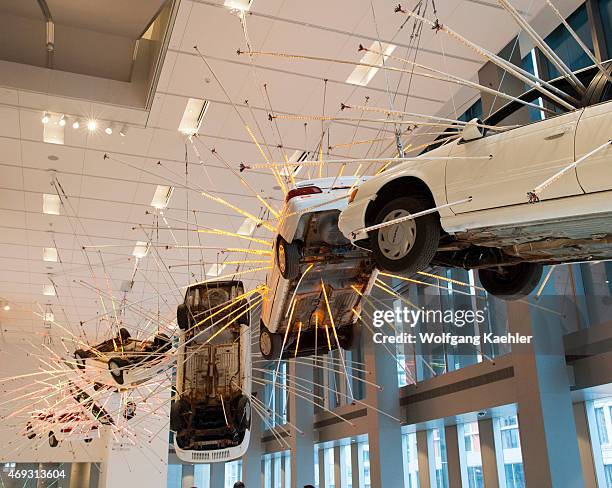 Inopportune: Stage One, from 2004, is a large-scale installation work consisting of a meticulous arrangement of life-size cars and multichannel tubes...