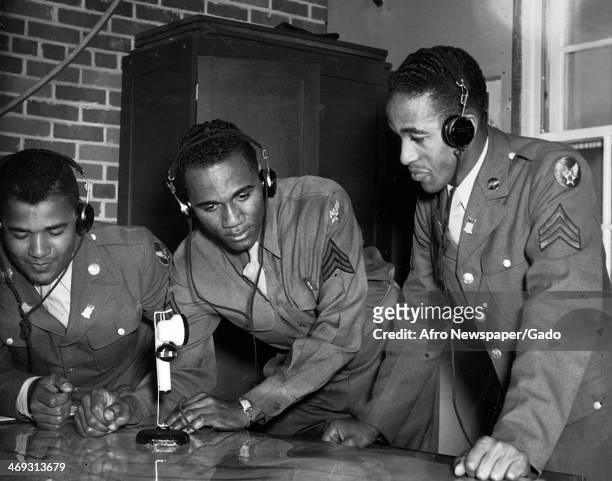 Photograph of Tuskegee Airmen at Tuskegee Army Flying School wearing headphones and speaking into a microphone, Tuskegee, Alabama, 1942.