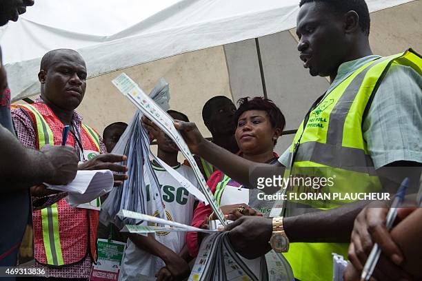 Independent National Electoral Commission officers begin the counting of vote in a polling station of Port Harcourt in Nigeria on April 11 2015....