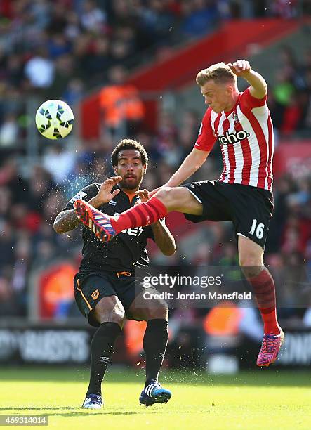 Tom Huddlestone of Hull City is beaten to the ball by James Ward-Prowse of Southampton during the Barclays Premier League match between Southampton...