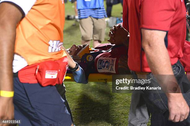 Quade Cooper of the Reds is taken from the field on a stretcher in a neck brace during the Super Rugby trial match between the Queensland Reds and...