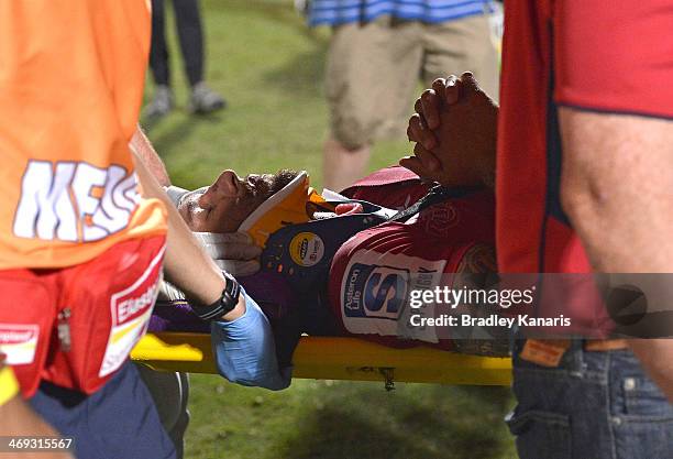 Quade Cooper of the Reds is taken from the field on a stretcher in a neck brace during the Super Rugby trial match between the Queensland Reds and...