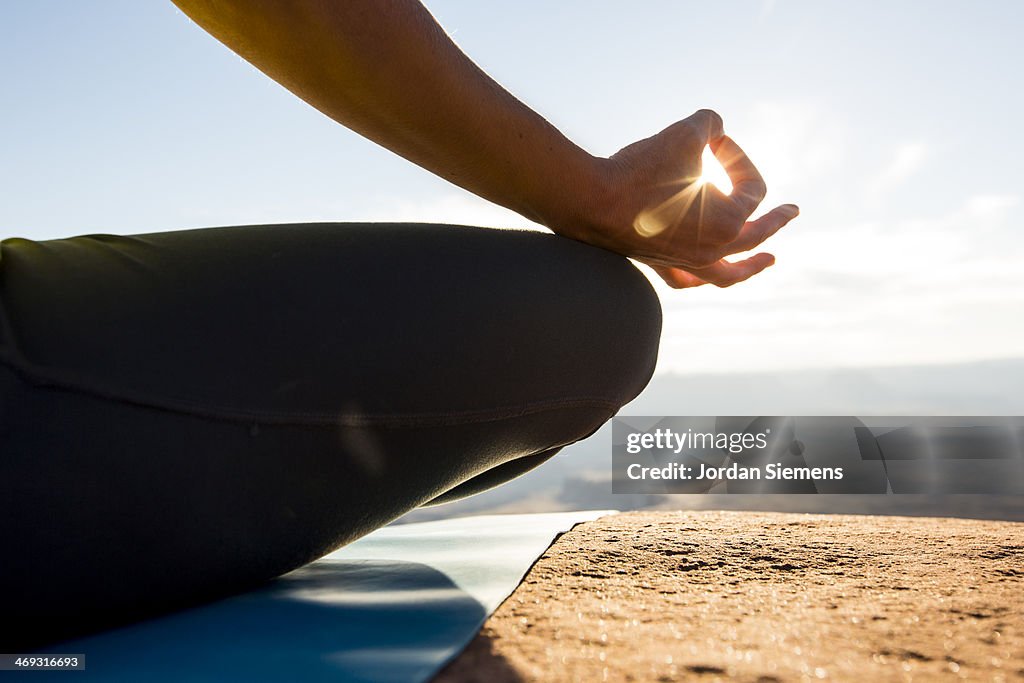 Female doing yoga and meditation outside