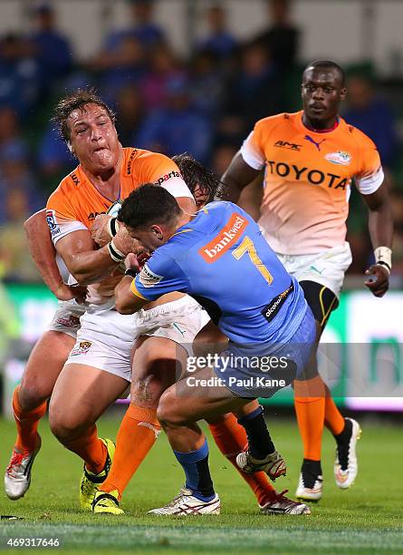 Coenie Oosthuizen of the Cheetahs gets tackled by Kane Koteka of the Force during the round nine Super Rugby match between the Force and the Cheetahs...