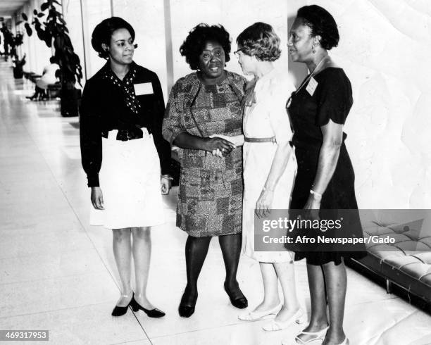 Full length portrait of civil rights leader Fannie Lou Harmer with Christine Moore, Janine [?] and Ruby Gill, 1969.