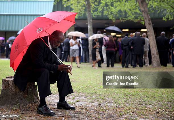 Eddie Bryan waits to enter the W.O.R.D. Ministries Christian Center for the funeral of Walter Scott, after he was fatally shot by a North Charleston...