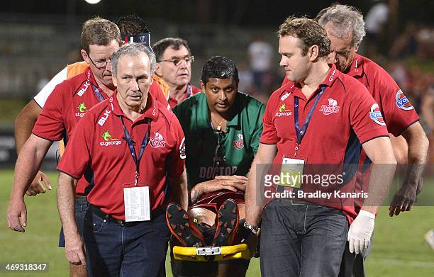 Quade Cooper of the Reds is taken from the field on a stretcher and in a neck brace during the Super Rugby trial match between the Queensland Reds...