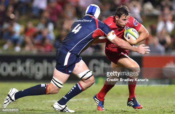 Mike Harris of the Reds attempts to break away from the defence during the Super Rugby trial match between the Queensland Reds and the Melbourne...
