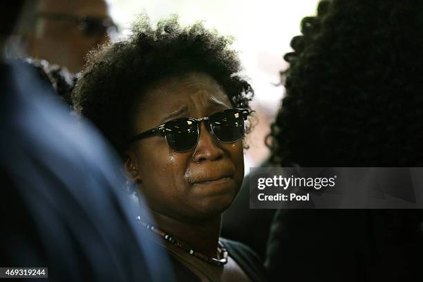 Family member weeps while entering the W.O.R.D. Ministries Christian Center for the funeral of Walter Scott, April 11, 2015 in Summerville, South...