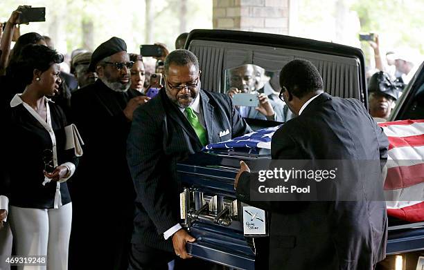 The casket of Walter Scott is removed from a hearse for his funeral at W.O.R.D. Ministries Christian Center, April 11, 2015 in Summerville, South...