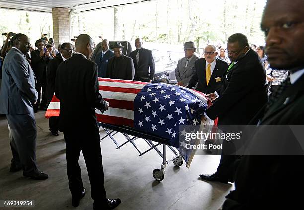 The casket of Walter Scott is wheeled into W.O.R.D. Ministries Christian Center for his funeral, April 11, 2015 in Summerville, South Carolina. Scott...