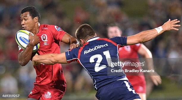 Aidan Toua of the Reds attempts to break away from the defence during the Super Rugby trial match between the Queensland Reds and the Melbourne...