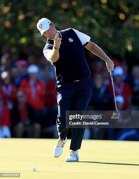 Peter Hanson of Sweden and the European Team just misses a birdie putt on the 15th green during the Singles Matches for The 39th Ryder Cup at Medinah...