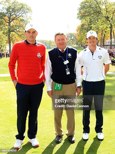 Keegan Bradley of the USA and Rory McIlroy of Europe with their match referee on the first tee during the Singles Matches for The 39th Ryder Cup at...