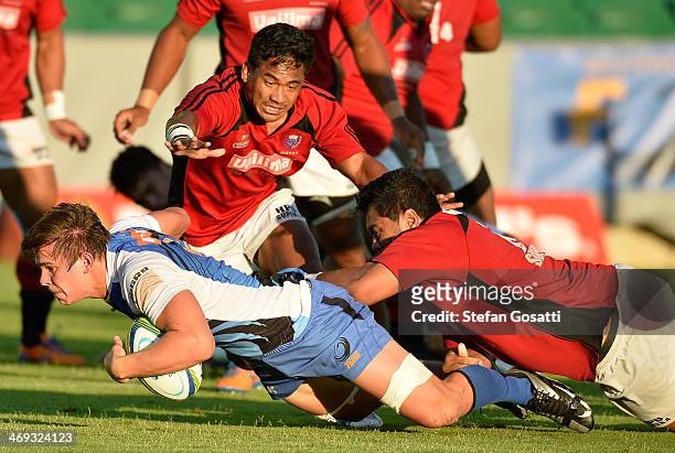 Richard Hardwick is tackled during the Super Rugby trial match between the Western Force and Samoa A at nib Stadium on February 14, 2014 in Perth,...