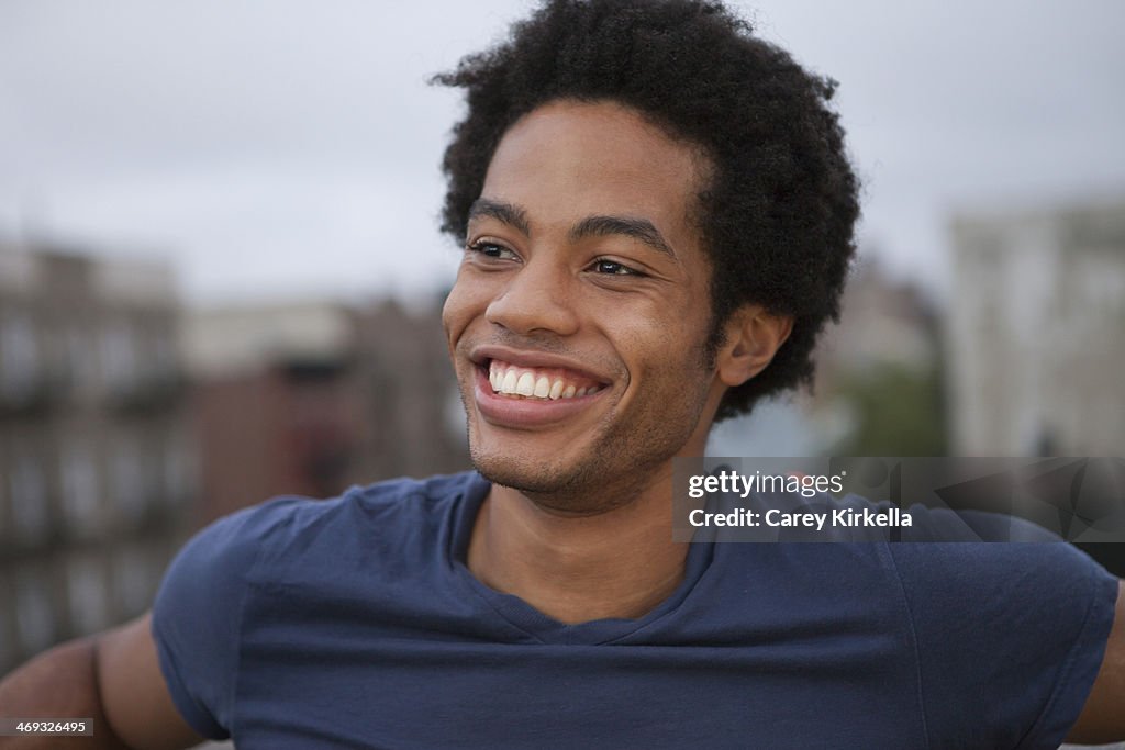 African American man on a roof top