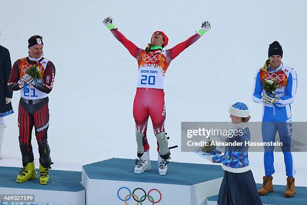 Silver medalist Ivica Kostelic of Croatia, gold medalist Sandro Viletta of Switzerland and bronze medalist Christof Innerhofer of Italy celebrate...