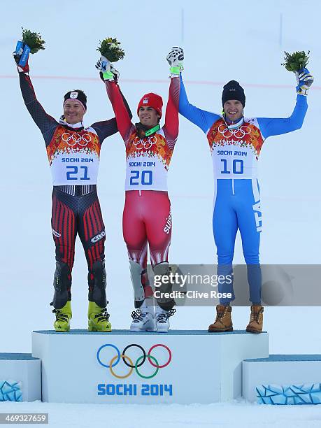 Silver medalist Ivica Kostelic of Croatia, gold medalist Sandro Viletta of Switzerland and bronze medalist Christof Innerhofer of Italy celebrate...