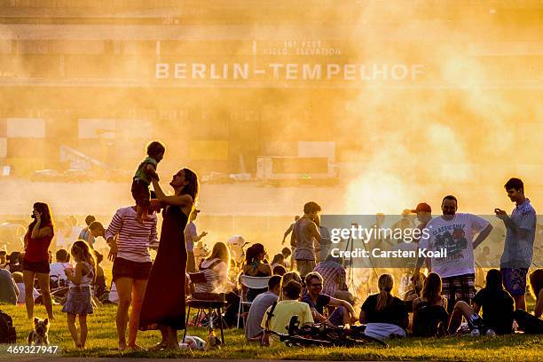 Visitors relax and prepare barbecue at former Tempelhof airport on August 18, 2012 in Berlin, Germany. Tempelhof, located in central Berlin, was an...